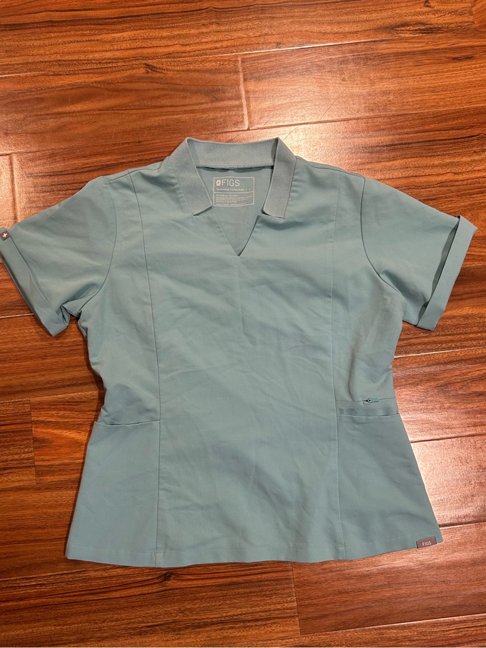 Figs light teal blue scrub top women’s large